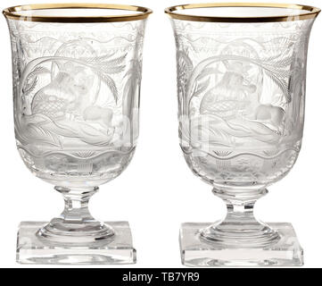 Hermann Göring - two goblets from a hunter's table service, Cut and faceted crystal glass with gold rims. On the viewing side an oriental prince lying in a palm grove and holding a roe deer fawn in his arms. The helmeted Göring family coat of arms set in a medallion on the reverse side. Rich floral decoration. Six-sided stems on square feet. Height 13 cm. Provenance: Voluntary auction from the former possessions of Hermann Göring, Neumeister, formerly Weinmüller, 157th Auction, 25 October 1974, lots 3051 to 3058. Presumably a gift for Göring's 50th birthday on 12 January 19, Editorial-Use-Only Stock Photo