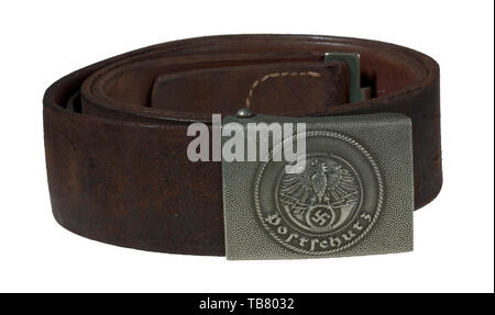 THE JOHN WAHL BELT AND BUCKLE COLLECTION, A Postschutz EM/NCO Leather Belt and Buckle, Stamped nickel silver buckle, pebbled outer field, embossed circular centre design. Brown leather tab stamped with a 1938 dated manufacturer's logo. Tab also stamped 'DRP' and 'Kblz'. 45 mm brown leather belt stamped 'DRP', 'Kblz' and '105'. Size adjustment tongue stamped 'ADAM & HERRMANN MAINZ'. Belt has two additional sets of pierced holes and is complete with nickel silver catch. Length approx. 105 mm., Additional-Rights-Clearance-Info-Not-Available Stock Photo
