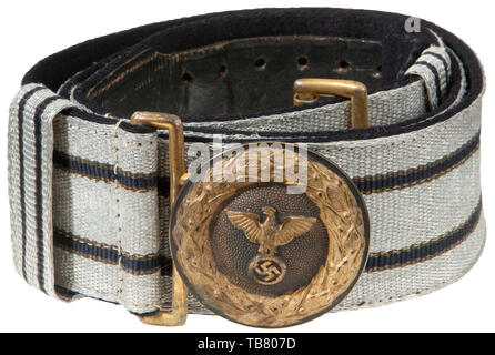 THE JOHN WAHL BELT AND BUCKLE COLLECTION, A Diplomatic/Government Official Brocade Belt and Buckle, 1939 Group 1. Stamped brass 47 mm diameter buckle, gold with silver-coloured pebbled centre dome, reverse unmarked. 44 mm service worn blue velvet backed aluminium/silver woven brocade with two blue stripes bordered by a gold stripe. Two sliding, vertical 22 mm keepers of the same pattern. Black leather size adjustment tongue ink stamped '90' complete with gold finished aluminium catch. Length approx. 90 cm., Additional-Rights-Clearance-Info-Not-Available Stock Photo