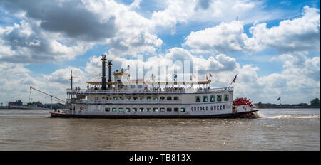 New Orleans, Louisiana, USA -- May 27, 2019.  The paddle wheel tourist boat Creole Queen on the Mississippi River. Stock Photo