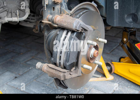 View of new brake discs and pads fitted to a car. Caliper removed Stock Photo