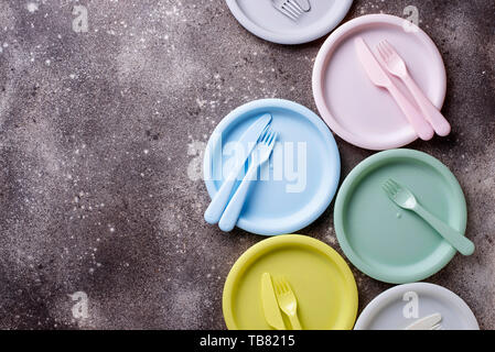 Colorful plastic dishes for summer picnic Stock Photo