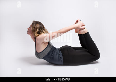 Tridhaatu - Dhanurasana (Bow Pose) yoga posture has been named after the  shape it takes - that of a bow. Dhanurasana is part of the lying down on  the tummy category and