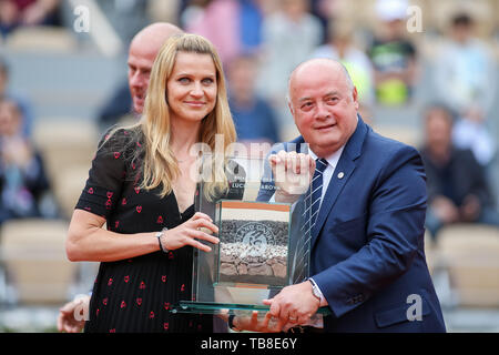 Lucie Safarova, Bernard Giudicelli, President of the French Tennis Federation pose with the trophy after a ceremony tribute to Lucie Safarova during the French Open tennis tournament at the Roland Garros in Paris, France on May 30, 2019. Credit: AFLO/Alamy Live News Stock Photo