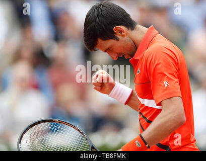 Paris, Paris. 30th May, 2019. Novak Djokovic of Serbia celebrates after the men's singles second round match with Henri Laaksonen of Switzerland at French Open tennis tournament 2019 at Roland Garros, in Paris, France on May 30, 2019. Credit: Han Yan/Xinhua/Alamy Live News Stock Photo