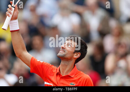 Paris, Paris. 30th May, 2019. Novak Djokovic of Serbia celebrates after the men's singles second round match with Henri Laaksonen of Switzerland at French Open tennis tournament 2019 at Roland Garros, in Paris, France on May 30, 2019. Credit: Han Yan/Xinhua/Alamy Live News Stock Photo