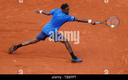 Paris, Paris. 30th May, 2019. Gael Monfils of France hits a return during the men's singles second round match with Adrian Mannarino of France at French Open tennis tournament 2019 at Roland Garros, in Paris, France on May 30, 2019. Credit: Han Yan/Xinhua/Alamy Live News Stock Photo