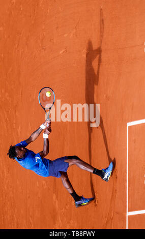 Paris, Paris. 30th May, 2019. Photo rotated by 90¡ãshows Gael Monfils of France hitting a return during the men's singles second round match with Adrian Mannarino of France at French Open tennis tournament 2019 at Roland Garros, in Paris, France on May 30, 2019. Credit: Han Yan/Xinhua/Alamy Live News Stock Photo