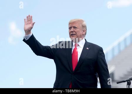 Colorado Springs, Colorado, USA. 30th May, 2019. U.S President Donald Trump waves as he takes the stage at the U.S. Air Force Academy Graduation Ceremony at the USAF Academy Falcon Stadium May 30, 2019 in Colorado Springs, Colorado. Credit: Planetpix/Alamy Live News Stock Photo