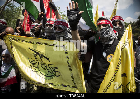 May 31, 2019, Tehran, Iran: Iranians attend a parade marking al-Quds (Jerusalem) International Day in Tehran. An initiative started by Iranian revolutionary leader Ayatollah Ruhollah Khomeini, Quds Day is held annually on the last Friday of the Muslim fasting month of Ramadan and calls for Jerusalem to be returned to the Palestinians. (Credit Image: © Rouzbeh Fouladi/ZUMA Wire) Stock Photo