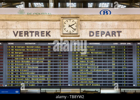 The departures board in Brussels Central station displays the names of the destinations alternately in french and dutch. Stock Photo