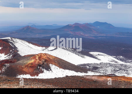 Volcanic landscape, massive, one of the volcanic complex on the Kamchatka Peninsula in the far east of Russia. Mountains covered with snow. Stock Photo