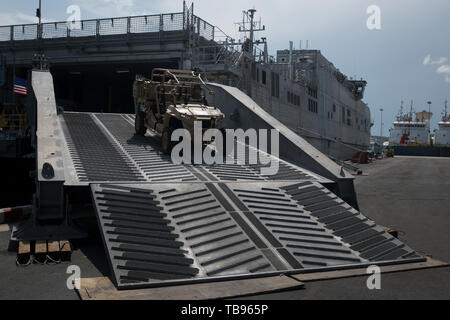 U.S. Marines with the Ground Combat Element, Marine Rotational Force – Darwin disembark the USNS Millinocket during Cooperation Afloat Readiness and Training (CARAT) at Chuk Samet Port, Thailand, May 27, 2019. CARAT is designed to promote regional security, maintain and strengthen maritime partnerships, and enhance interoperability among participating forces. (U.S. Marine Corps photo by Lance Cpl. Kaleb Martin) Stock Photo