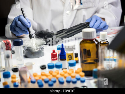 Expert Police takes samples in scientific laboratory, conceptual image Stock Photo