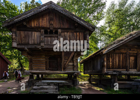 Traditional Norwegian wooden houses from Telemark region with grass on the roof at Norsk Folkemuseum, (Norwegian Museum of Cultural History). Olso Stock Photo