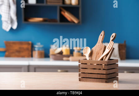 Set of wooden kitchen utensils on table Stock Photo