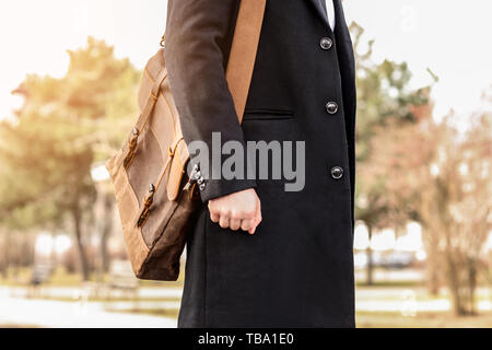 Businessman with stylish briefcase on city street Stock Photo