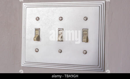 frame Panorama frame Close up of the electrical light switch against the white wall of a house Stock Photo