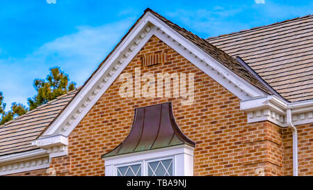frame Panorama frame Luxurious exterior of a house with lush trees and serene sky background Stock Photo