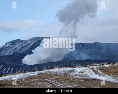 Japan's active volcano Mount Aso erupting in winter Stock Photo