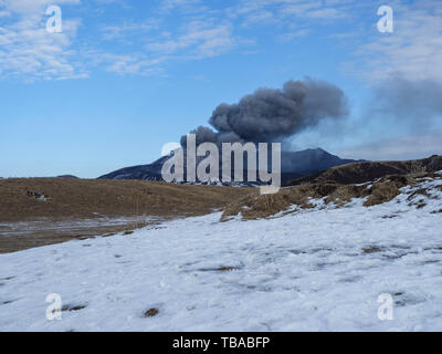 Japan's active volcano Mount Aso erupting in winter Stock Photo