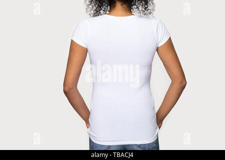 Cropped image african female wearing white t-shirt rear view Stock Photo
