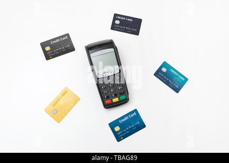 Payment terminal, credit card machine with some credit cards top view composition Stock Photo