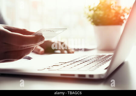 Man using credit card while internet shopping. Credit card online payment concept. Stock Photo