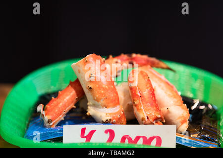 Tokyo, Japan Street in Tsukiji outer market near Ginza with closeup display of cooked lobster with expensive price sign Stock Photo