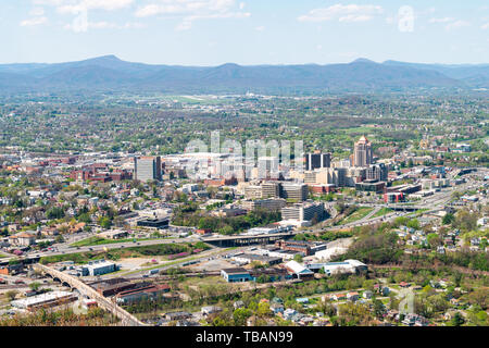 Roanoke, USA - April 18, 2018: Aerial cityscape downtown office view on city in Virginia with business buildings and mountains highway Stock Photo