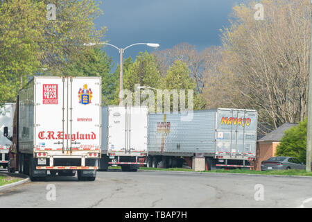 Christiansburg, USA - April 19, 2018: Truck stop on highway in Virginia with signs for Navajo and C.R. England Stock Photo