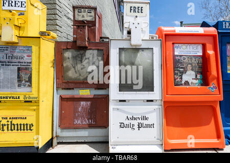 Asheville, USA - April 19, 2018: Downtown old town street in hipster North Carolina NC famous town with sign for newspaper kiosk stand Stock Photo