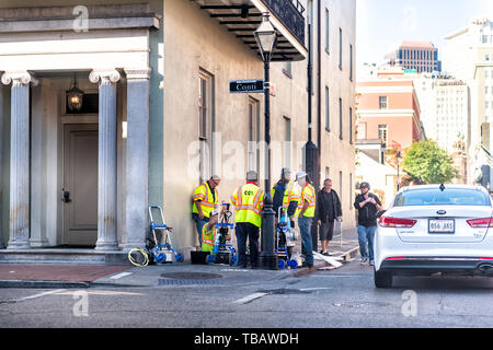 New Orleans, USA - April 23, 2018: Downtown street in Louisiana famous city with construction workers on sidewalk road by Conti sign Stock Photo