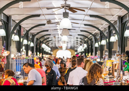 New Orleans, USA - April 23, 2018: Old town French Quarter covered food and flea market inside in Louisiana city and people shopping Stock Photo