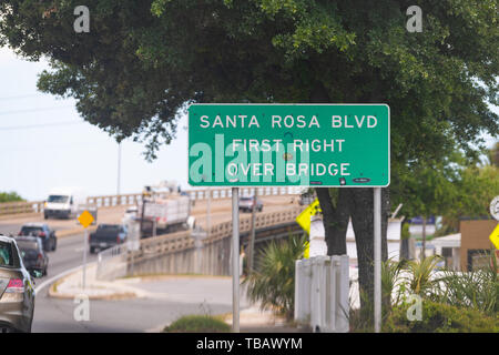 Fort Walton Beach, USA - April 24, 2018: Green road sign for Santa Rosa Blvd boulevard street in Florida Panhandle city, town in Gulf of Mexico at Eme Stock Photo