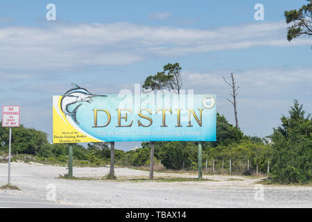 Destin, USA - April 24, 2018: Road sign, billboard with Welcome to Destin the World's luckiest fishing village in Florida Panhandle Stock Photo