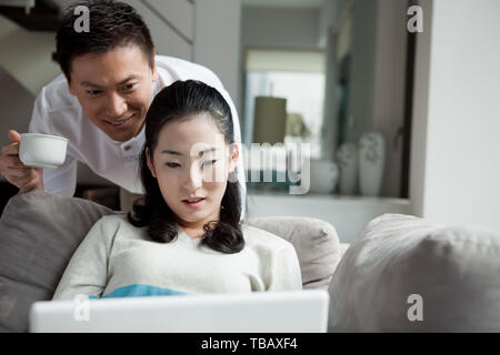 A couple using a laptop Stock Photo