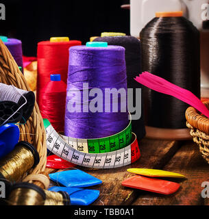 Coil threads for overlock and measuring band in sewing supplies Stock Photo