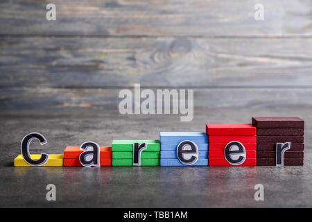 Stacked blocks with word CAREER on grey background Stock Photo