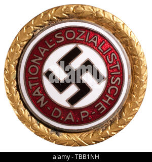 THE JOHN PEPERA COLLECTION, A Golden Party Badge of the NSDAP in 30 mm, Deschler produced gilt Tombak with inset silver-plated, enamelled party badge. Party member number '94711' on reverse with stamped 'GES. GESCH.' above decorated buttonhole tab., Editorial-Use-Only Stock Photo