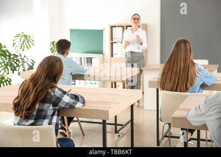 Pupils during lesson in classroom Stock Photo