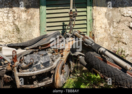 Old rusted abandoned motorcycle in desolate barn Stock Photo - Alamy