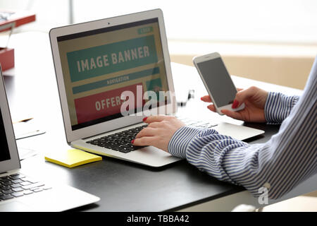 Female IT designer working in office Stock Photo