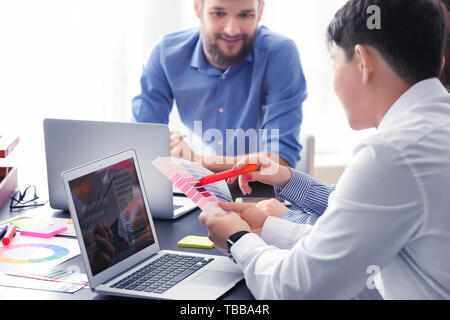 Young IT designers working in office Stock Photo