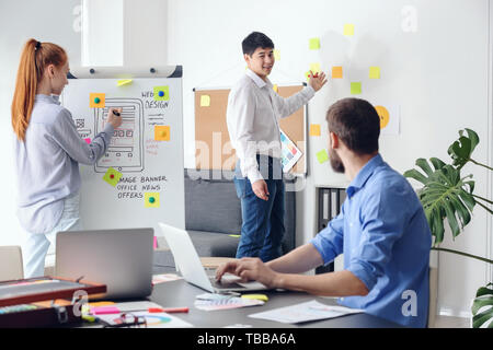 Young IT designers working in office Stock Photo