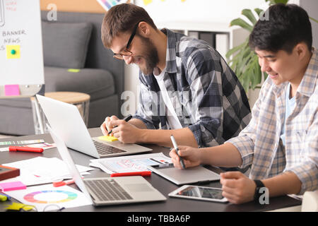 Young IT designers working in office Stock Photo