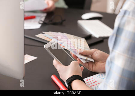 Male IT designer working in office Stock Photo