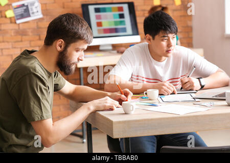 Young IT designers working in office Stock Photo