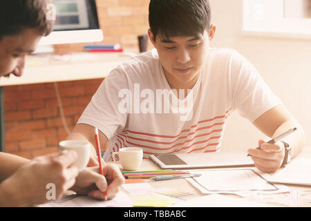 Young IT designers working in office Stock Photo