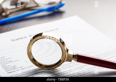 Magnifying Glass and document close up Stock Photo
